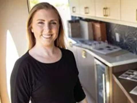 Portrait of a smiling woman in a kitchen